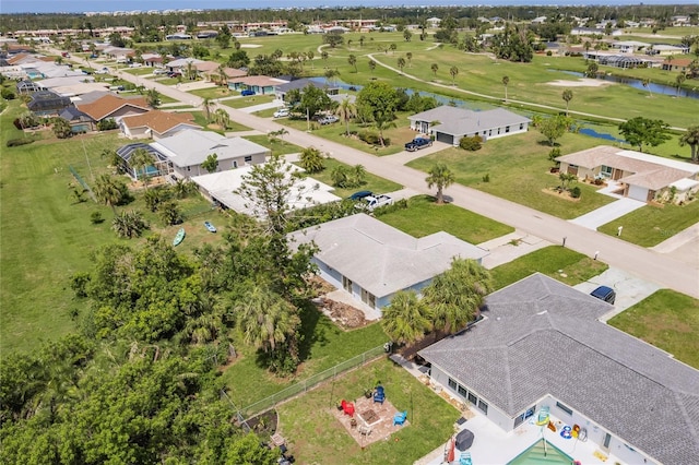 37 Oakland Hills Ct, Rotonda West, FL 33947 - aerial view of residential area featuring a large body of water and a golf course
