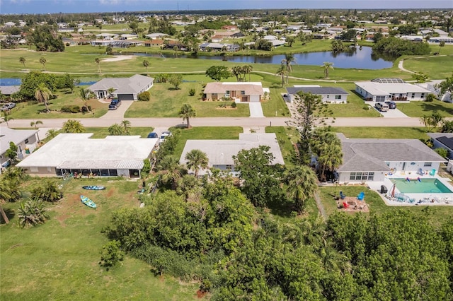 37 Oakland Hills Ct, Rotonda West, FL 33947 - aerial view of residential area with a large body of water and a golf club