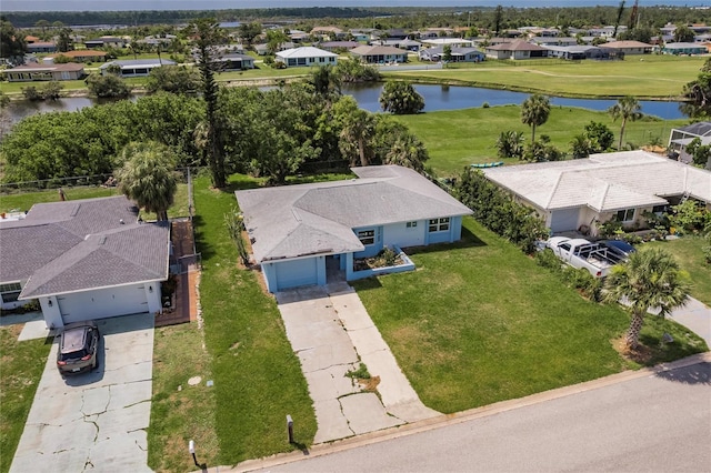 37 Oakland Hills Ct, Rotonda West, FL 33947 - aerial view of residential area with a large body of water