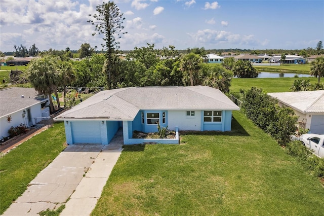 37 Oakland Hills Ct, Rotonda West, FL 33947 - ranch-style home featuring a water view, a garage, a front yard, concrete driveway, and a residential view