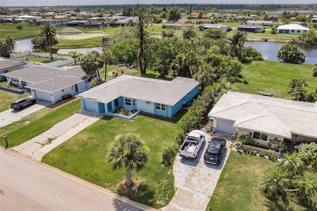37 Oakland Hills Ct, Rotonda West, FL 33947 - aerial view of residential area featuring a large body of water