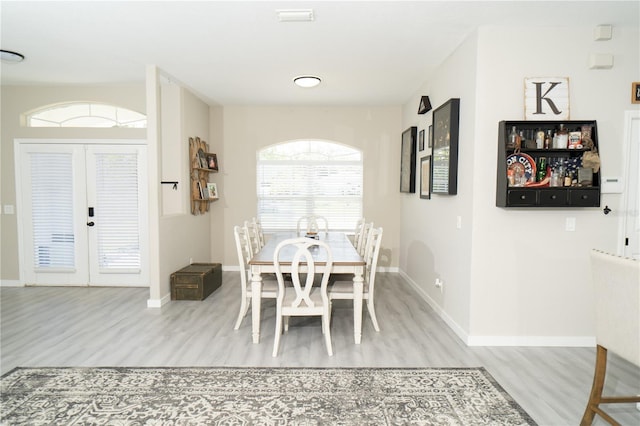 6794 Loffreda Ave, North Port, FL 34291 - dining room featuring light wood-style floors and french doors