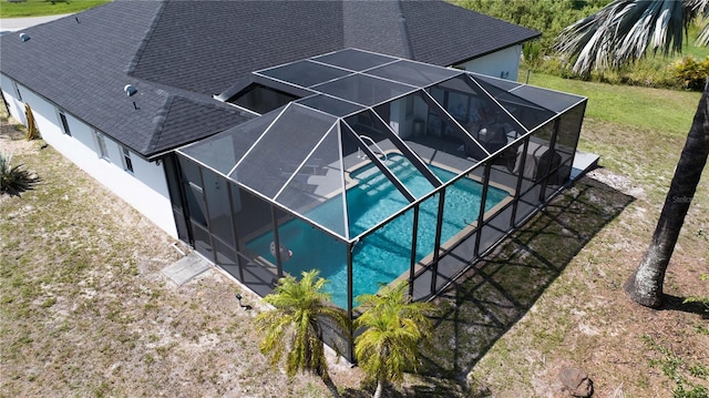 6794 Loffreda Ave, North Port, FL 34291 - swimming pool with glass enclosure, a patio area, and a yard