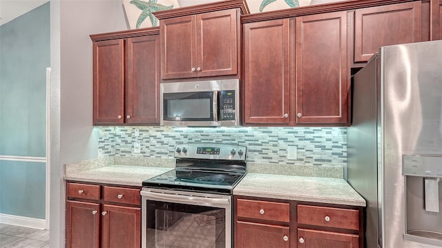 237 Strasburg Dr, Port Charlotte, FL 33954 - kitchen with stainless steel appliances, light countertops, and backsplash