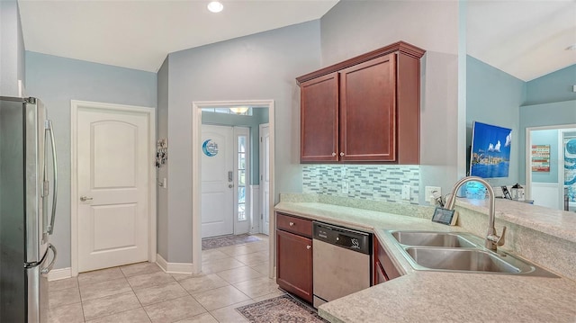 237 Strasburg Dr, Port Charlotte, FL 33954 - kitchen featuring stainless steel appliances, light tile patterned floors, light countertops, tasteful backsplash, and a peninsula