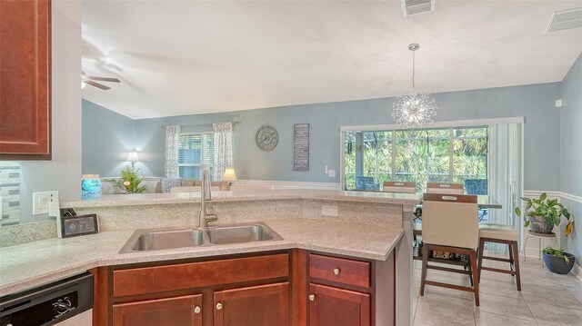 237 Strasburg Dr, Port Charlotte, FL 33954 - kitchen featuring dishwashing machine, light countertops, ceiling fan, hanging light fixtures, and light tile patterned floors