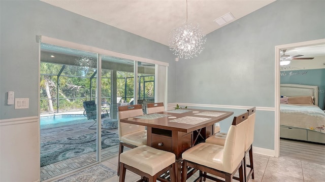237 Strasburg Dr, Port Charlotte, FL 33954 - dining room featuring a chandelier, light tile patterned floors, and a ceiling fan