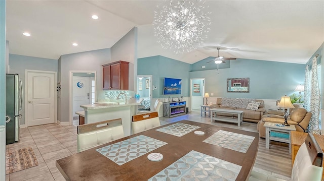 237 Strasburg Dr, Port Charlotte, FL 33954 - living area with vaulted ceiling, a ceiling fan, and light tile patterned flooring