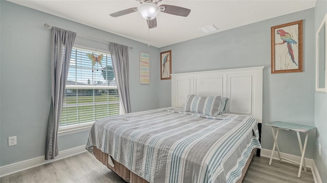 237 Strasburg Dr, Port Charlotte, FL 33954 - bedroom featuring light wood-style floors and a ceiling fan