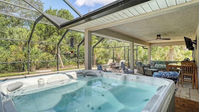 237 Strasburg Dr, Port Charlotte, FL 33954 - sunroom featuring a jacuzzi, an outdoor living space, a ceiling fan, and healthy amount of natural light