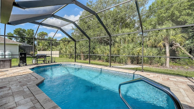 237 Strasburg Dr, Port Charlotte, FL 33954 - swimming pool featuring a patio area, glass enclosure, and grilling area