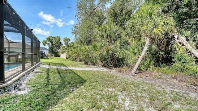 237 Strasburg Dr, Port Charlotte, FL 33954 - view of grassy yard featuring an outdoor pool and a lanai