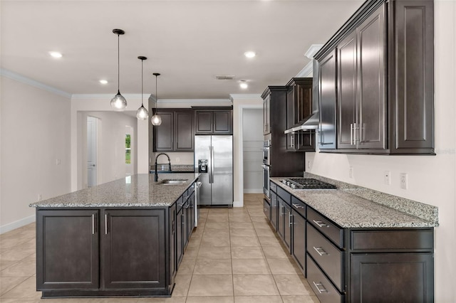 42346 Waterfront Way, Punta Gorda, FL 33982 - kitchen with stainless steel appliances, a sink, baseboards, dark brown cabinetry, and a center island with sink