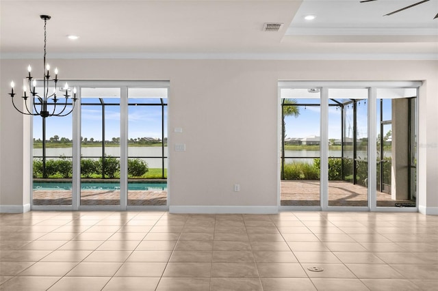 42346 Waterfront Way, Punta Gorda, FL 33982 - unfurnished room with baseboards, ornamental molding, a chandelier, a water view, and recessed lighting