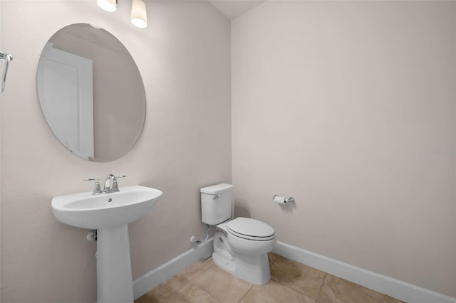 42346 Waterfront Way, Punta Gorda, FL 33982 - bathroom with tile patterned flooring, toilet, and baseboards