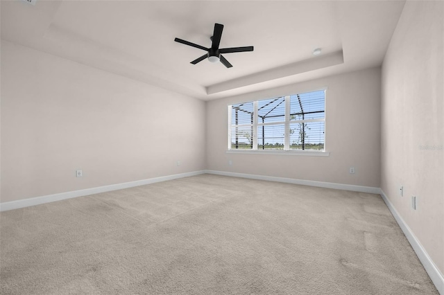42346 Waterfront Way, Punta Gorda, FL 33982 - carpeted spare room featuring a tray ceiling, a ceiling fan, and baseboards