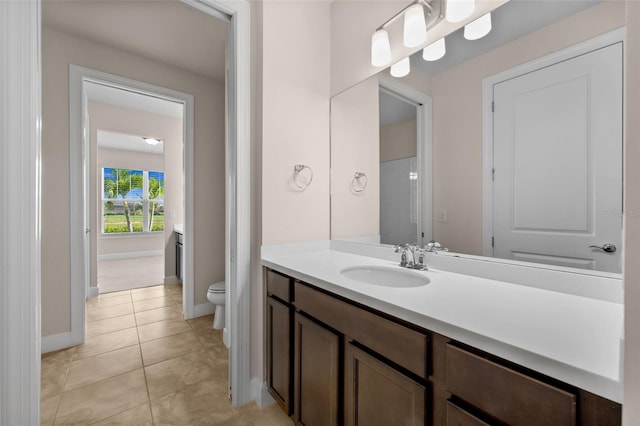 42346 Waterfront Way, Punta Gorda, FL 33982 - bathroom with toilet, vanity, baseboards, and tile patterned floors