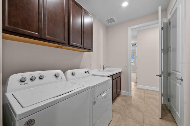 42346 Waterfront Way, Punta Gorda, FL 33982 - laundry area featuring cabinet space, washing machine and dryer, baseboards, light tile patterned flooring, and recessed lighting