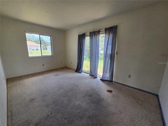 4424 Baroda Ave, North Port, FL 34287 - unfurnished room featuring healthy amount of natural light, carpet, and baseboards