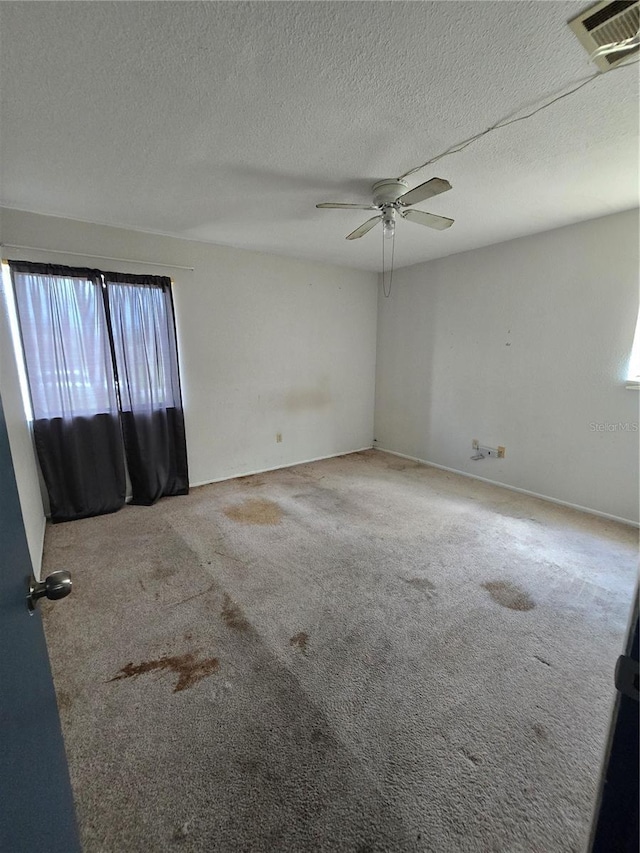 4424 Baroda Ave, North Port, FL 34287 - carpeted empty room featuring a ceiling fan and a textured ceiling