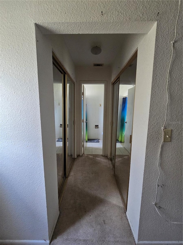 4424 Baroda Ave, North Port, FL 34287 - hallway with carpet flooring and a textured wall