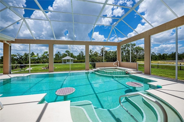 17400 White Water Ct, Punta Gorda, FL 33982 - view of pool featuring view of scattered trees, a yard, a pool with connected hot tub, a patio area, and a gazebo