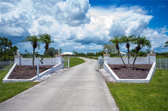 17400 White Water Ct, Punta Gorda, FL 33982 - surrounding community with a fenced front yard and a gate