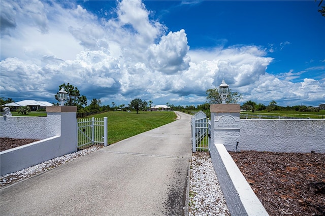 17400 White Water Ct, Punta Gorda, FL 33982 - view of street with street lighting, a gate, and a gated entry