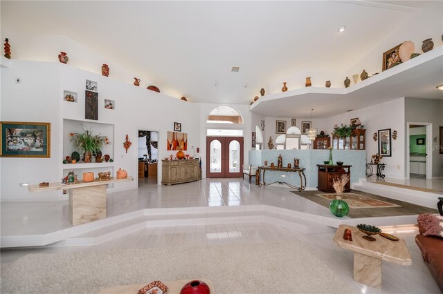 17400 White Water Ct, Punta Gorda, FL 33982 - unfurnished living room featuring tile patterned floors and french doors