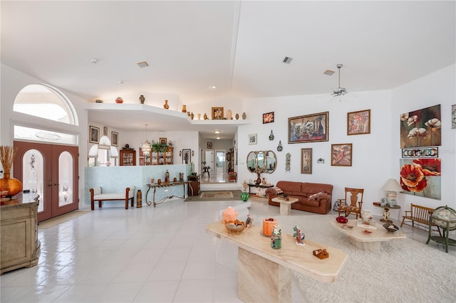 17400 White Water Ct, Punta Gorda, FL 33982 - living area featuring french doors, a ceiling fan, vaulted ceiling, and light tile patterned floors