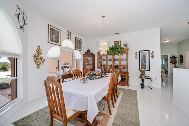 17400 White Water Ct, Punta Gorda, FL 33982 - dining area featuring a chandelier and light tile patterned floors