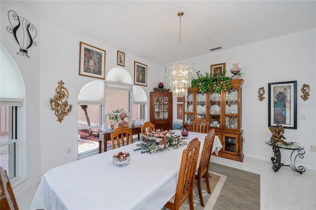17400 White Water Ct, Punta Gorda, FL 33982 - dining room with a chandelier, plenty of natural light, and light tile patterned floors