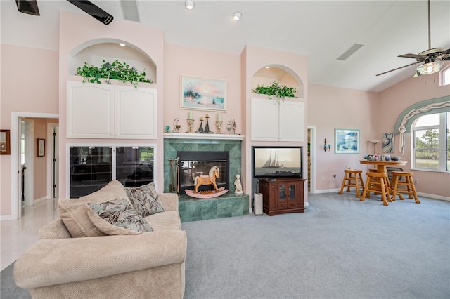 17400 White Water Ct, Punta Gorda, FL 33982 - living area featuring ceiling fan, a fireplace, lofted ceiling, and light carpet