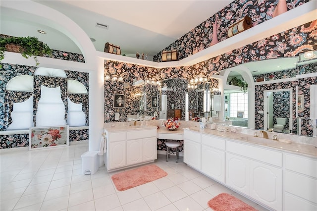17400 White Water Ct, Punta Gorda, FL 33982 - full bathroom featuring wallpapered walls, vanity, tile patterned floors, and vaulted ceiling