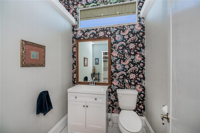 17400 White Water Ct, Punta Gorda, FL 33982 - bathroom with wallpapered walls and vanity