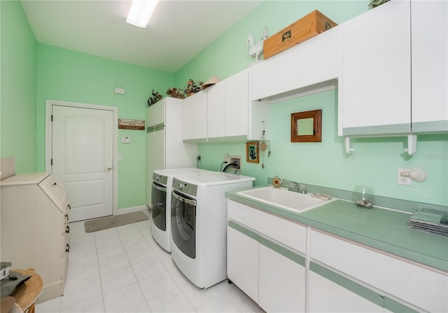 17400 White Water Ct, Punta Gorda, FL 33982 - washroom with cabinet space, washing machine and dryer, and light tile patterned flooring