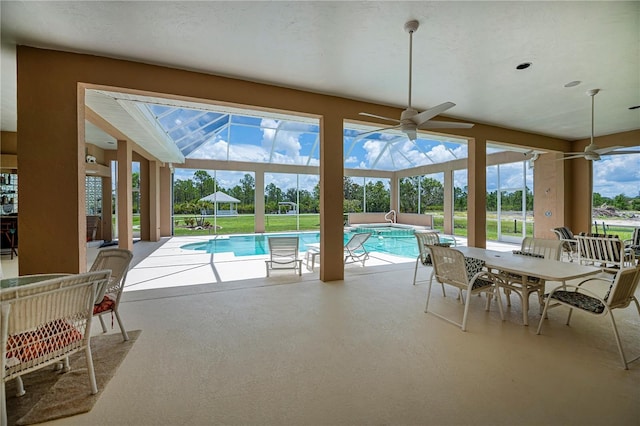 17400 White Water Ct, Punta Gorda, FL 33982 - swimming pool with a ceiling fan, a patio, a yard, glass enclosure, and a jacuzzi