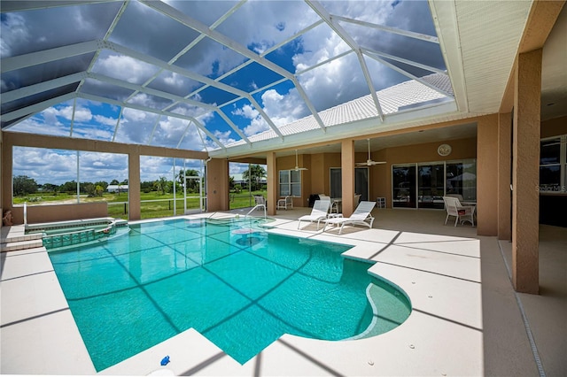 17400 White Water Ct, Punta Gorda, FL 33982 - view of pool with a ceiling fan, a patio area, a pool with connected hot tub, and glass enclosure