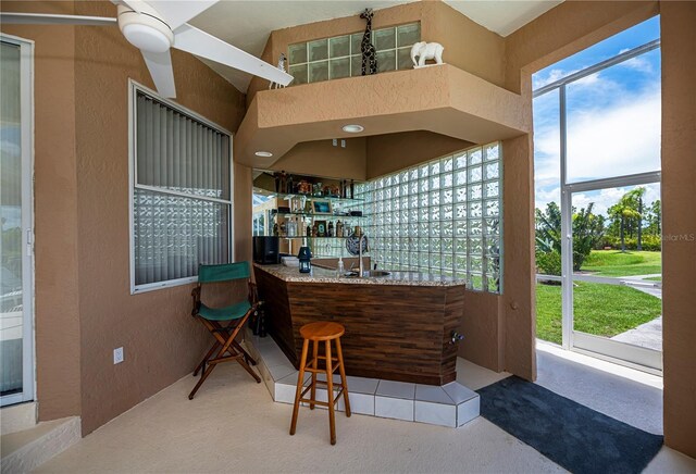 17400 White Water Ct, Punta Gorda, FL 33982 - community bar area with a textured wall and carpet flooring