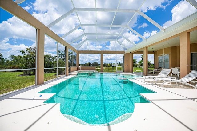 17400 White Water Ct, Punta Gorda, FL 33982 - view of swimming pool with a patio, a pool with connected hot tub, glass enclosure, and a yard