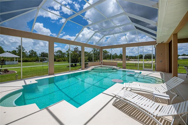 17400 White Water Ct, Punta Gorda, FL 33982 - view of pool featuring a yard, a patio area, glass enclosure, a pool with connected hot tub, and a gazebo