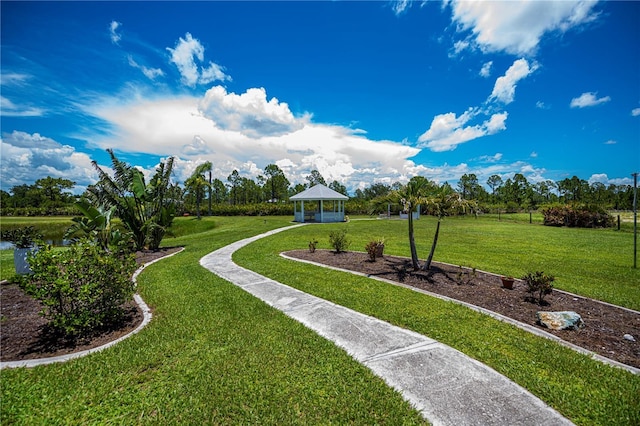 17400 White Water Ct, Punta Gorda, FL 33982 - view of green lawn featuring a gazebo and view of wooded area