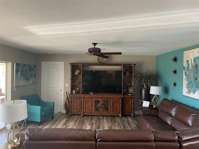 26129 Madras Ct, Punta Gorda, FL 33983 - living room featuring wood finished floors, ceiling fan, and baseboards