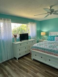 26129 Madras Ct, Punta Gorda, FL 33983 - bedroom featuring dark wood-type flooring and ceiling fan