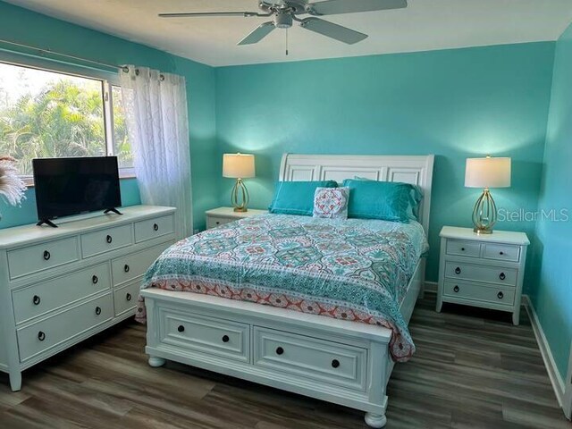26129 Madras Ct, Punta Gorda, FL 33983 - bedroom with dark wood-type flooring, baseboards, and ceiling fan