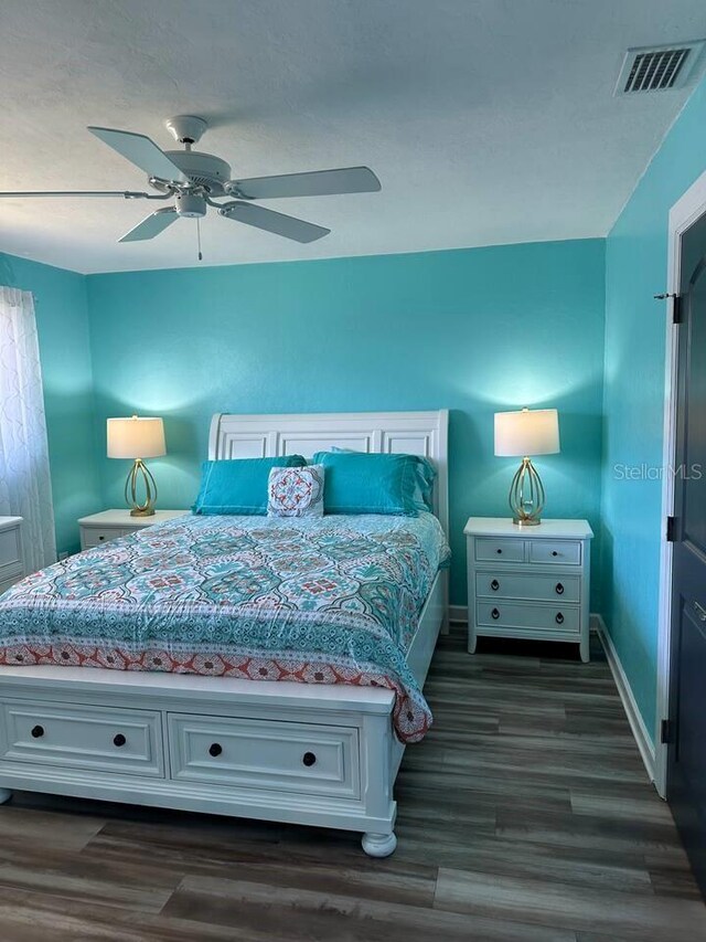 26129 Madras Ct, Punta Gorda, FL 33983 - bedroom with dark wood-type flooring, baseboards, and ceiling fan