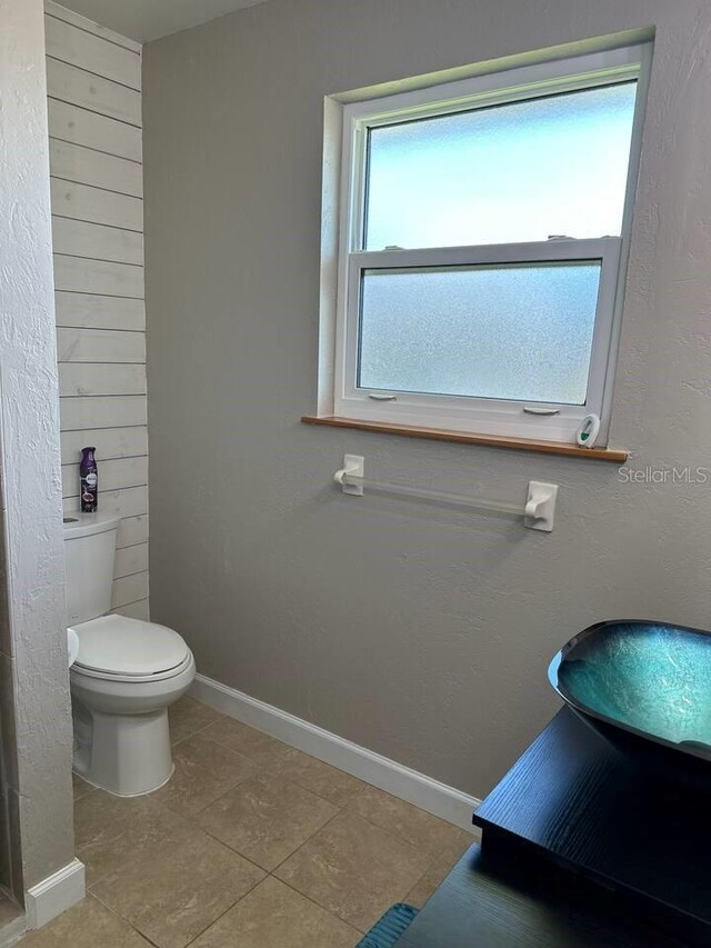 26129 Madras Ct, Punta Gorda, FL 33983 - bathroom featuring toilet, baseboards, and tile patterned floors