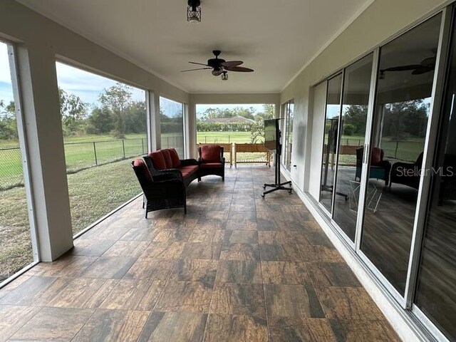 26129 Madras Ct, Punta Gorda, FL 33983 - sunroom / solarium featuring ceiling fan and wood finished floors