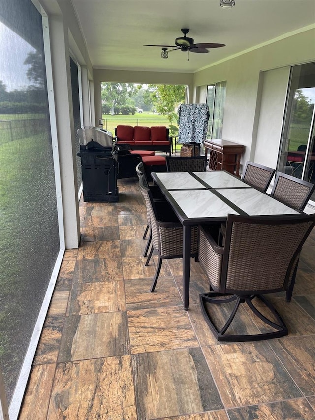 26129 Madras Ct, Punta Gorda, FL 33983 - sunroom featuring ceiling fan, an outdoor living space, and outdoor dining space