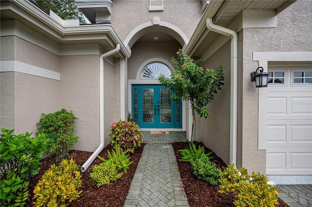 1062 Eagles Flight Way, North Port, FL 34287 - property entrance with french doors and stucco siding